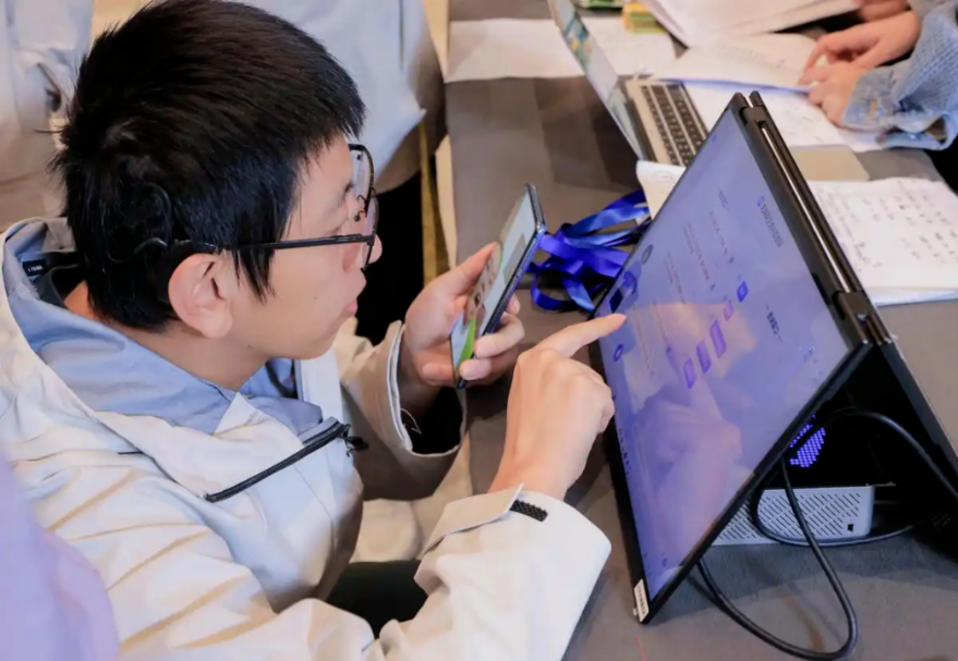 A person with a disability using the barrier-free communication system developed by iFlytek.