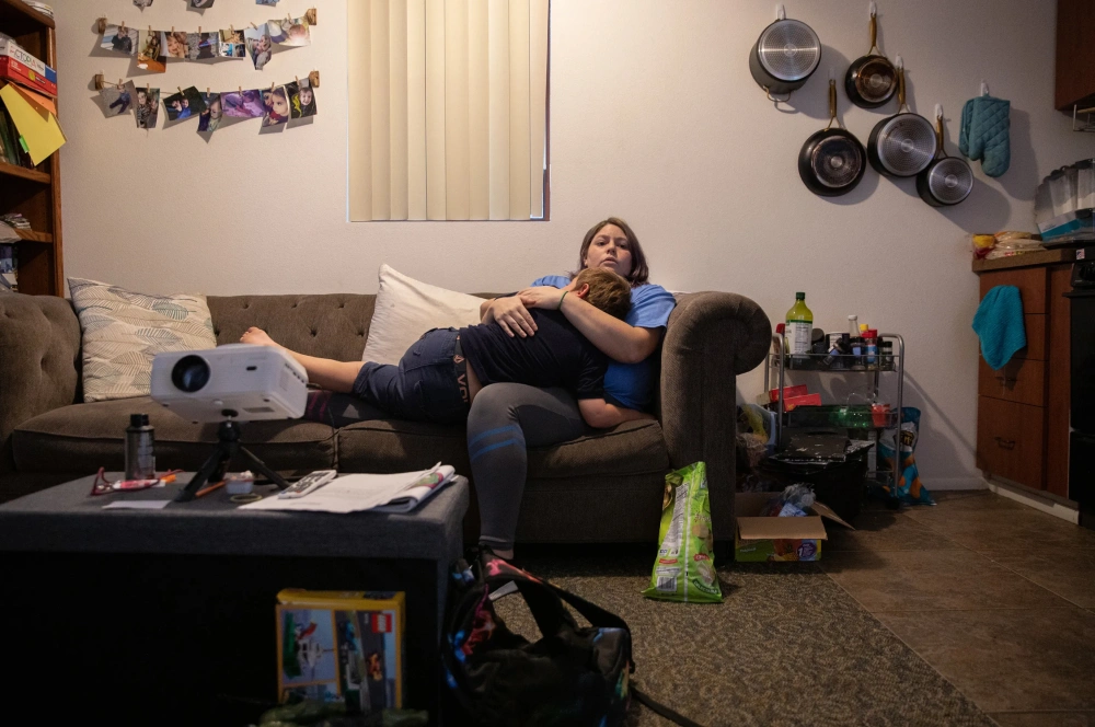 In her Phoenix apartment, Ariana Belmudes comforts her son, David.